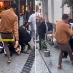 Esnaf, yere yatırdığı kişiyi acımasızca dövdü